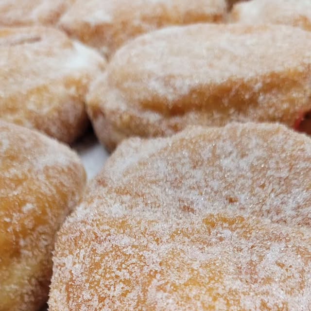 A close view of sugar-rolled donuts at World's Fair Donuts